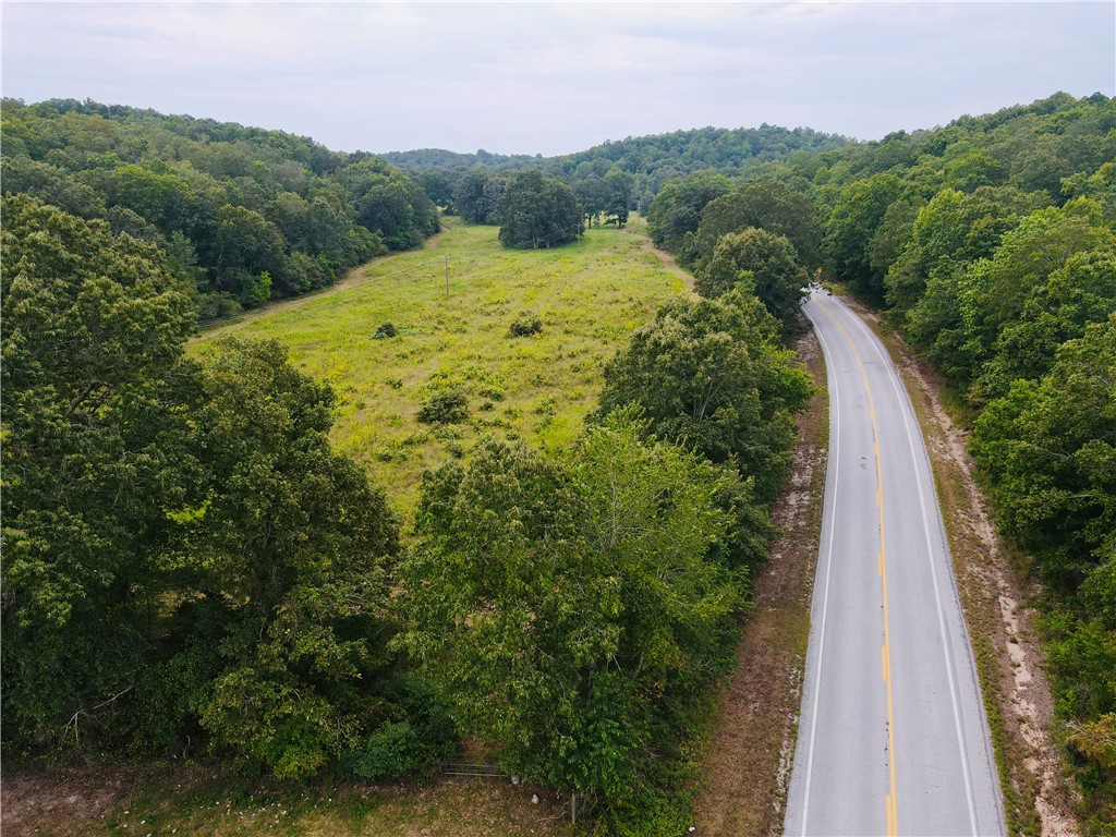 This 10-acre property sits on both sides of paved Highway 27 and is just minutes from the Buffalo National River, Ozark National Forest, Sylamore WMA, Loaferās Glory WMA, and the White River, offering endless opportunities for outdoor recreation. With about 3 acres cleared and 7 acres in woods, it provides a great mix of open space and privacy, making it an ideal place to build. Electric, water, and high-speed fiber are already on the property, making it ready for a home, cabin, or weekend retreat in the heart of the Ozarks. More adjoining land could possibly be purchased if you are looking for a larger tract.