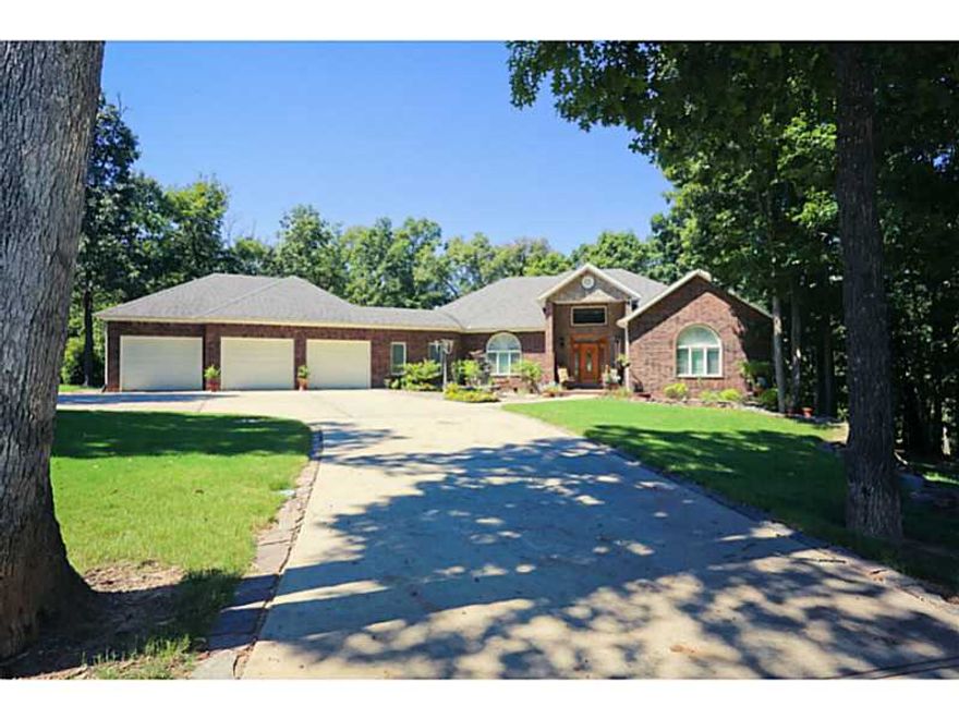 Big & Beautiful!! 5193 sqft Executive home featuring 4 bedrooms, 3 1/2 baths, and 3 car garage on almost 2 Acres!  Enjoy your Master bedroom with attached sitting area, fireplace and private outside deck. 3 beautiful bedrooms downstairs, second family,room with built in bar, bonus room, extra storage room, and safe room. Outside flagstone patio/fire pit and wonderful outdoor living space surrounded by nature and lots of deer. Great neighborhood, Close to Golf Course, and Beaver Lake.