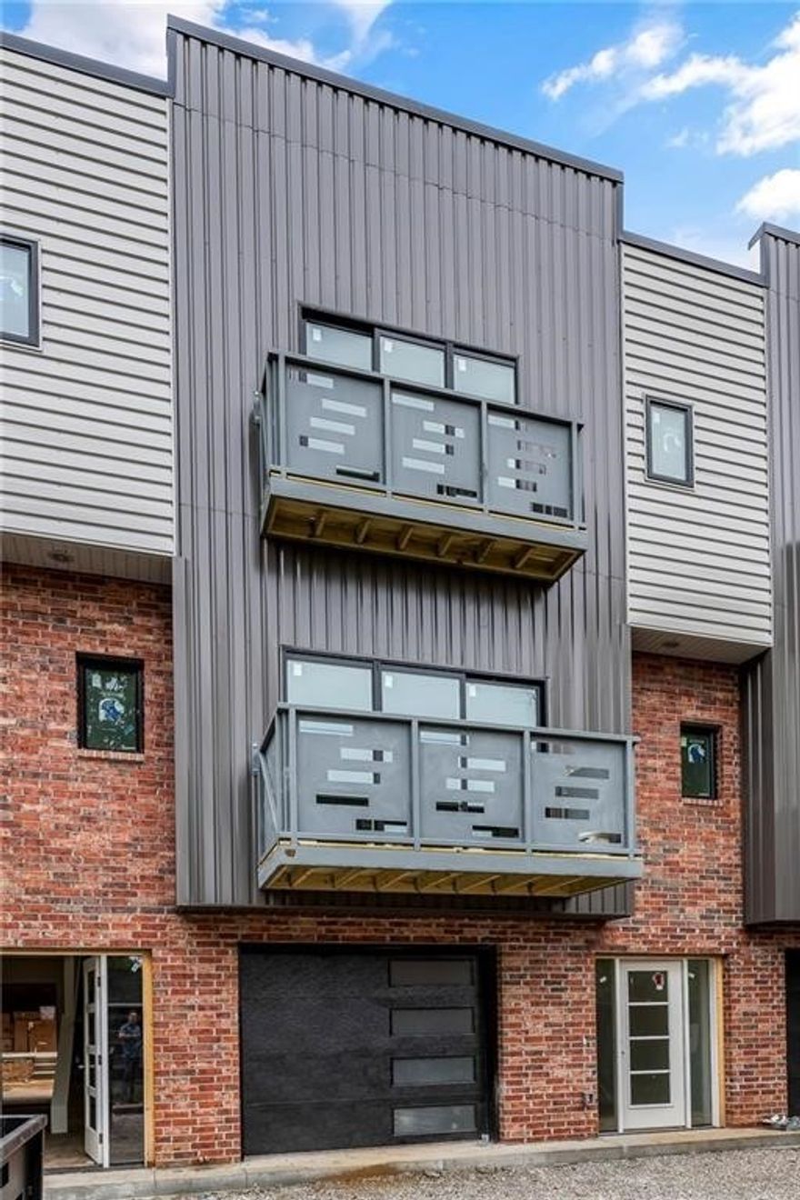 SoMa Terrace Bentonville, 2 bedroom 2 1/2 bath Townhome 1 block from the new Walmart Campus. Great space with a modern industrial vibe. Water proof wood style flooring throughout. Open concept, with lots of natural light Kitchen includes stainless appliances and solid surface counters. Each bedroom has a private bath and large closet. Covered patio and 1 car garage. Landscape included. Pets negotiable and include additional pet rent and non-refundable deposit.