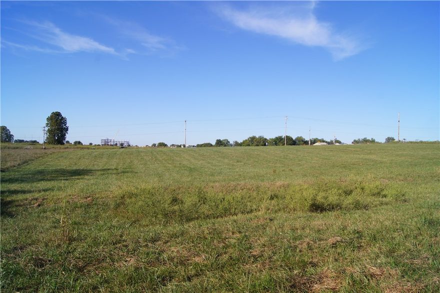Corner commercial lot with 4.34 acres located on Don Tyson Parkway, just West of I-49. With interstate visibility, this property is perfect for future commercial development. All utilities available. Located near Highlands Oncology Children's Hospital, Arvest Ballpark, and NWACC. Traffic Count of 75,000 daily. See other lots for sale, MLS#: 1144514, 1144518, 1144520, 1144521.
