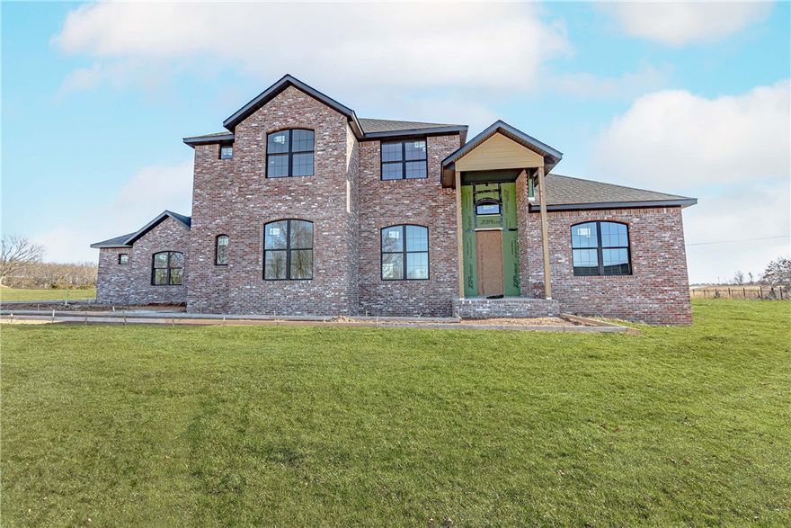 One of a kind new construction in the sought after West End neighborhood. This home offers instant curb appeal with its brick exterior and vaulted front porch. High-end finishes and features throughout the home including cathedral ceilings, 2 fireplaces, a large kitchen island. The spacious owner’s suite is complete with  a large walk-in closet and immaculate ensuite bathroom. The backyard is an entertainer’s dream with a covered back patio. This private gated community is conveniently located just minutes from I-49 and the Walmart Home Office. This home is a MUST SEE!