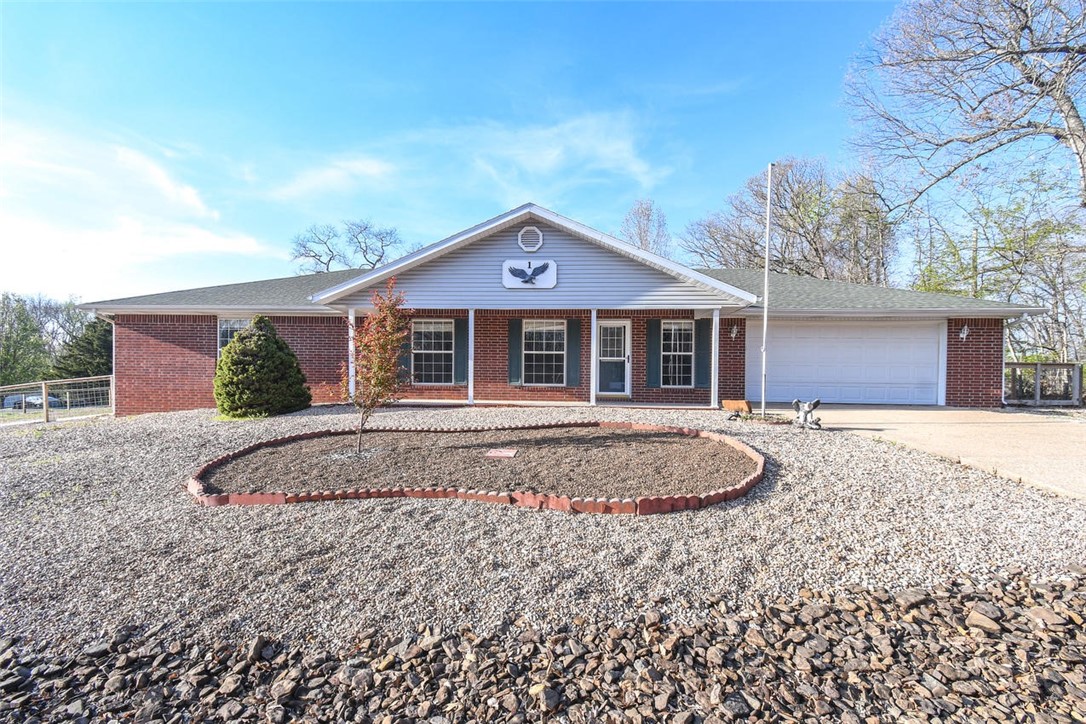 Discover this stunning residence in Picturesque Bella Vista, Ar, Situated on a spacious, double .73 acre corner, flat lot. 10 Min drive to Loch Lomand, Lake Avalon, Windsor, Norwood, Tanyard,. HVAC new 2023,New fence, huge livingroom. Office or 3rd bedroom. Laundry Room, 2 walk in closets, large kitchen pantry. Heated and cooled sunroom. Whirlpool tub in owner suite. Guest bathroom has a walk-in-shower. All this on a large flat lot.