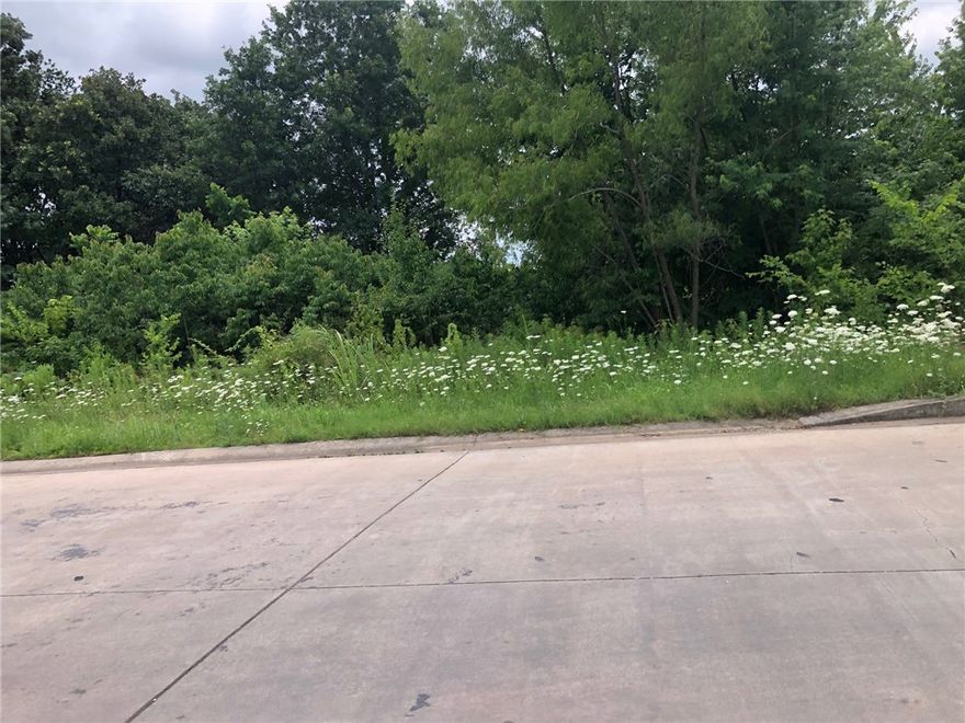 Property has highway frontage, utilities available.  Electric, Gas and Sewer at the street, water on site.   Adjacent to the City Park, close to the Post Office and Gentry Public School.