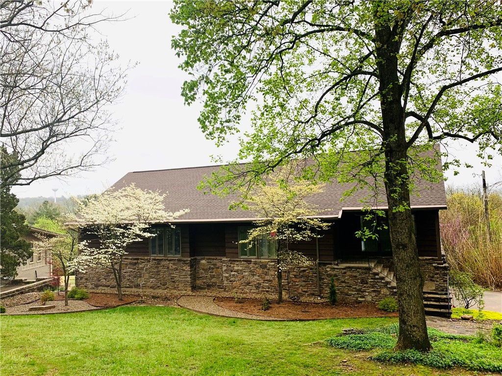Check out this RARE find and amazing 4,045 square foot home in Fayetteville! If you are looking for a large home full of tasteful upgrades such as New wood floors, New HVAC, New deck, Roof replacement in 2018, along with multiple other remodels, this is the home for you! One of the home’s most special features is the view of the mountains and so much of Fayetteville! Picture yourself sitting out on your private back deck, enjoying your very own hammock park set up, grilling, bird-watching, and embracing Mt. Sequoyah’s beauty! This home is near Root Elementary, Mt. Sequoyah trails, Mt. Sequoyah Center, 8 minutes to the trailhead to bike and hike, as well as in a quiet neighborhood with one of the rare full mountain and tree line views off the deck. You will love the finished basement that can be used as a second living/ game/movie area/wet bar area, an investment rental with its’ own exterior entrance, or simply for extra bedroom and bonus space! Don’t’ miss this park-like estate home and large lot!