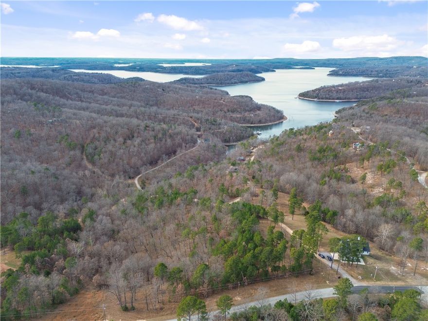An exceptional opportunity to build on a 1.55 acre lot in a peaceful Beaver Lake neighborhood. Priced to sell, this lot is right off a paved road making it builder-friendly. It offers a stunning lake view, breathtaking sunsets and the flexibility to create a personal getaway or an STR investment. A 24’ x 10’ boat slip with a boat lift in the community dock makes enjoying the lake effortless.