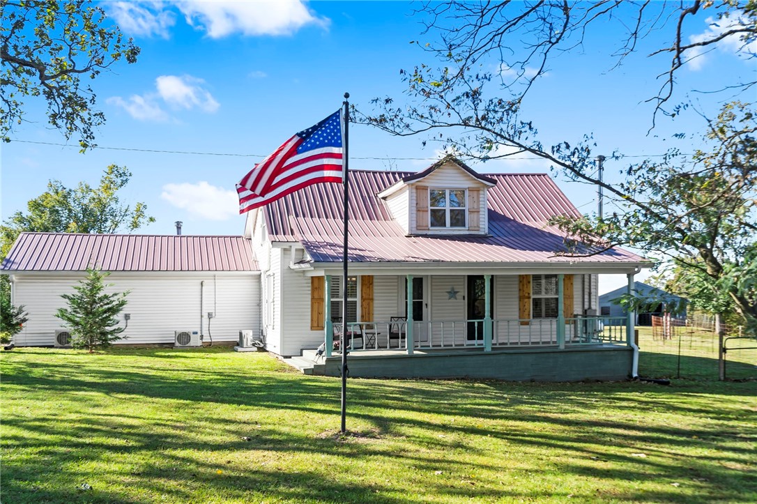 Welcome to Rocky Jack Rescue Farmāa one-of-a-kind 4-acre property where history, heart, and modern updates meet. Built in 1935 and lovingly restored, this home features refinished hardwood floors, two wood-burning fireplaces, and a large second living room with blackout-film windows. Updates include new HVAC with six mini-splits, ductwork, 75-gallon hot water heater, gas stove, and remodeled primary suite with walk-in Jacuzzi tub. Outside offers a solar-powered gated entrance, oversized 3-car garage/shop with storm shelter and 6-person wet sauna, two barns with water/electric, greenhouse, and deck with pergola. Cross-fenced pastures and magnolia, apple, and walnut trees create a beautiful, private setting. A fully functioning hobby farm and animal rescue just 5 minutes from downtown Rogersācomplete with thriving farm animals and endless charm. Sellers have completed extensive improvementsāsee attached info sheet. Truly a rare find!