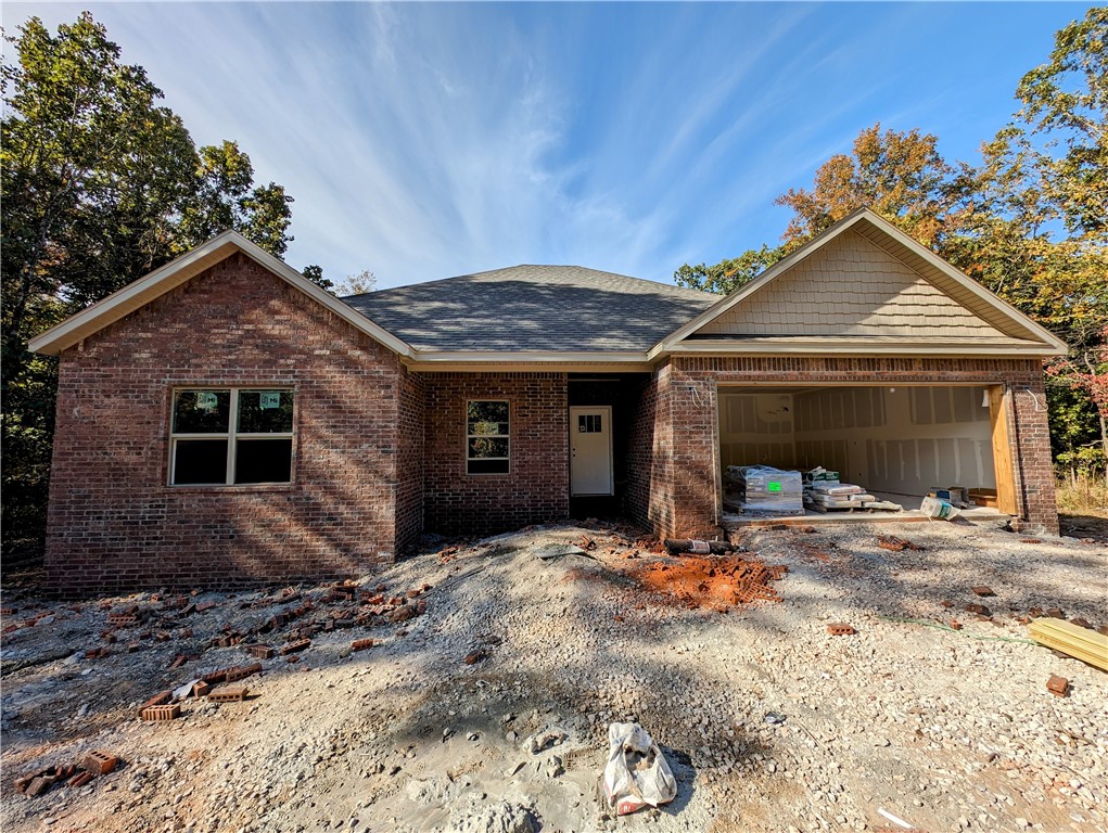 Welcome To Your Next Home! This Split Floorplan New Construction Lives Big And Offers An Open Concept Kitchen/Dining/Living, 9 Foot Ceilings, Custom Cabinets, Granite Counters, Nice Primary Suite With Large Primary Bath That Provides A Dual Vanity, Walk-in Closet, Tile Shower. Solid Surface Main Area Flooring, Tile In Laundry/Baths, Carpet In Bedrooms. Secondary Bed Plus Office (could be 3rd bed, no closet), Plus Guest Bath On Opposite Side Of Home. Brick Front; Nice Covered Back Deck That Overlooks The Beauty Of Nature That Is Bella Vista. Wrapping Up Late Dec/Jan. Still Time To Make Some Selections. Come See! **Under construction pics are of actual home. Completed pics are of similar plan and finishes, but this home will vary.