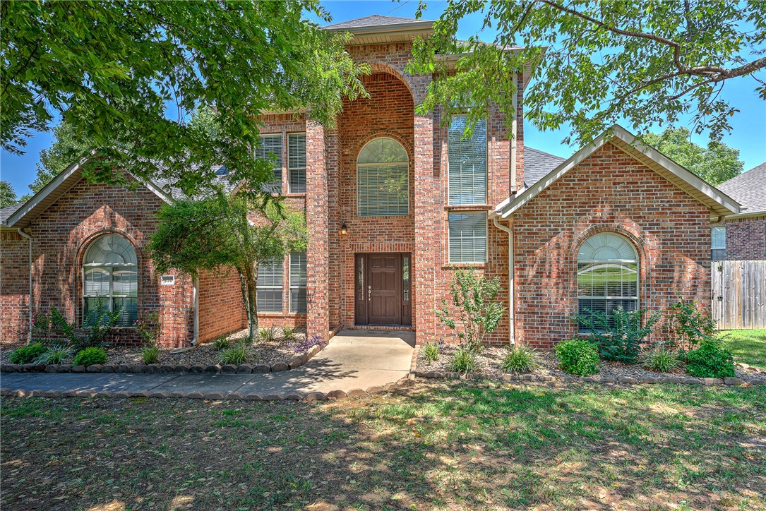 Welcome to this beautiful and spacious 2 level all brick home. Corner lot with mature trees in the front yard. Gorgeous elevated portico encases the front door. This home boasts plenty of natural light through the many oversized windows. 4 spacious bedrooms, the primary bedroom has a sizable walk in closet as well as a large en suite bathroom. Enjoy your morning coffee while sitting on the back deck or in the screened in back porch. Farmington schools. 2.6 miles to Creekside Park. 6.2 miles to the University of Arkansas. 4.4 miles to Centennial Park.