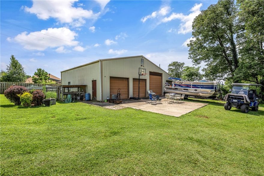 Tucked away on 3 acres, this rare in-town gem offers the best of both worlds: secluded rural living with unbeatable access to schools, parks, and amenities. Fully fenced and full of charm, the property features a massive 2,080 square foot shop with four bay doors, perfect for hobbies, storage, or business needs. The updated kitchen flows into a cozy living room, while the screened porch and hot tub offer year-round relaxation. The spacious primary suite is conveniently located on the main level, with two additional bedrooms and a full bath upstairs. Bonus features include a chicken coop, mature trees, and room to roam. Whether you’re looking for privacy, productivity, or a little backyard homesteading, this one checks all the boxes. Additional 5.4 acres available for purchase.  See also MLS numbers 1314772 and 1319631.