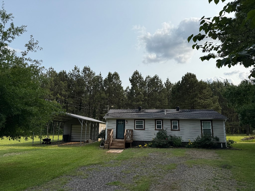 Discover this charming 3-bedroom, 1.5-bathroom home on 5 acres, offering 1,024 square feet of comfortable living space. Enjoy the convenience of being within walking distance to Lake Ludwig, and with Redlick Mountain Bike Trails just outside your driveway, adventure is never far away!
This home has been thoughtfully updated with a new roof (2023), new energy-efficient windows (2024), and new kitchen cabinets (2023), ensuring a fresh and inviting feel. The property includes a 16' x 20' enclosed shop with concrete floors and electricity, plus a covered parking area attached to the shop. An additional small shed is perfect for storing fishing gear or could easily be transformed into a chicken coop.
Nature lovers will appreciate the small creek on the property, and there's plenty of space for gardening, additional buildings, or simply enjoying the peaceful countryside. Wave Fiber Internet is already installed and ready to transfer, so you can stay connected while enjoying country living.