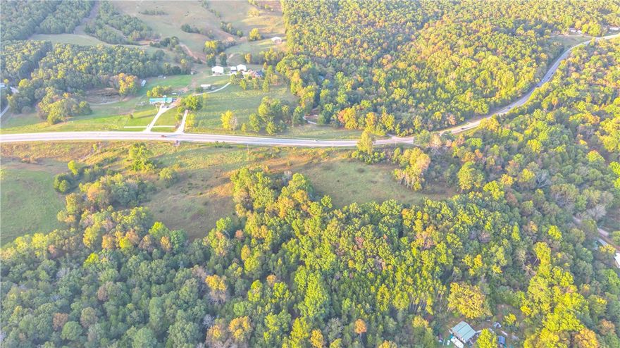 Discover a fantastic investment opportunity with this prime piece of land featuring major highway 412 frontage. With just over 13 acres, this versatile property offers endless possibilities. Whether you're looking to build a commercial space or your dream home, this one is for you. Enjoy the convenience of electric, water and cable already at the street. This listing is for 2 separate parcels; acreage shown reflects both parcels.