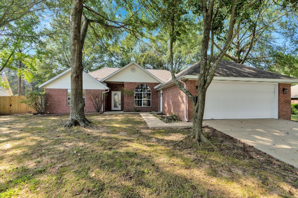 Welcome to this inviting 3-bedroom, 2-bath home located in a desirable neighborhood. Inside, you’ll find a bright and welcoming floor plan featuring a spacious eat-in kitchen with granite countertops and a formal dining room—perfect for gatherings. The living room offers a cozy gas log fireplace for relaxing evenings. The primary suite is a true retreat with his-and-her closets and a private bath. A convenient Jack-and-Jill bathroom connects the additional bedrooms, making the layout ideal for families or guests. Step outside to enjoy the covered back patio overlooking the fenced backyard. With thoughtful features throughout and a location in a sought-after neighborhood, this home blends comfort, functionality, and lifestyle.