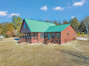 Experience the beauty of the Ozark Mountain living in this log siding home set on 15.71 acres near Harrison, AR. The well-designed open floor plan provides a harmonious living space, complemented by a generous primary bedroom featuring a large walk-in closet. Privacy is a key feature of the acreage, enhanced by thoughtfully crafted trails for leisurely walks or bike rides. And a garden space for those searching sustainable living options. You must see the setting to appreciate. The loft 4th bedroom adds a touch of versatility, suitable for use as an office, hobby room, or even a home-school classroom. Centrally located in the heart of the Ozarks, this property offers a serene retreat just a short 10-minute drive from town. Explore the wonders of the region