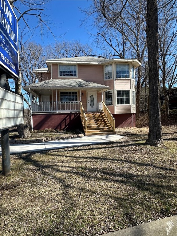 COMPLETELY RENOVATED AND UPDATED 5-UNIT RESIDENTIAL & COMMERCIAL BUILDNG located directly on Hwy 62 near Historic Downtown Eureka Springs. Perfectly positioned to capture multiple income sources. Zoned C2C allows for a variety of residential and commercial uses. Currently permitted for 5-Units Short Term/Overnight Rental Units with separate unit entrances and HVAC. Could also be permitted for long term apartment units. Fully sprinklered, on-site parking, exterior pylon sign, wrap around porch and units with a variety of full kitchen or kitchenettes. Mixed residential-commercial use possible. Can be used for offices with additional occupancy permit.