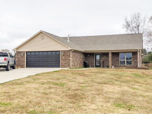 Move In ready for your family. This home sits on 2 city lots with huge pecan trees in the back. New windows and storm doors and remolded kitchen . It features 3(or 4th bedroom or small office 2 full baths.Nice new deck ,double metal carport and outside storage building with lean to in the big back yard.