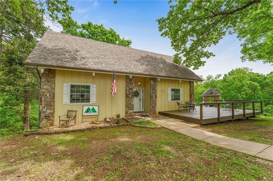 Prime investment opportunity in the heart of the Ozarks! This versatile property is a successful nightly rental, but could also be a vacation home, or full-time residence. Sitting on approx 1 acre, it's fully furnished and turn-key, including the Hot Tub that is only 1 year old. Enjoy breathtaking panoramic mountain views, just 10 minutes from Big Cedar Lodge, Top of the Rock, and Thunder Ridge Nature Arena, and only 20 minutes to Branson's top attractions. Cricket Creek Marina and lake access are just 2 minutes away, perfect for boating and fishing enthusiasts. Want to add a pool and amenities, or updates to significantly boost rental income and long-term value? It may be possible to roll those added costs into the purchase. Easy highway access, stunning scenery, and strong rental demand make this a must-see for investors and lifestyle buyers alike! The property being sold is approx 1 acre, new survey and Sellers Deed to govern.