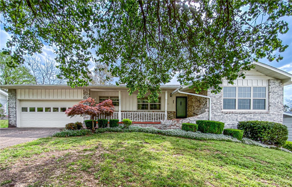 Established community and close to schools, makes this location perfect for the family. Home has 4 good size bedrooms and two bathrooms. Ample storage from the linen closet in the hallway to closets within each bedroom. The extra sitting area includes a maple built in hutch that stays. As you walk into the main living room to the left are floor to ceiling maple shelves that set off this large living room. Landscaped with curb appeal. Windows abound for natural lighting and most of the floors have been redone throughout. An extra large utility room with storage and access to outside is a plus. Home is move in ready just in time for an awesome summer.