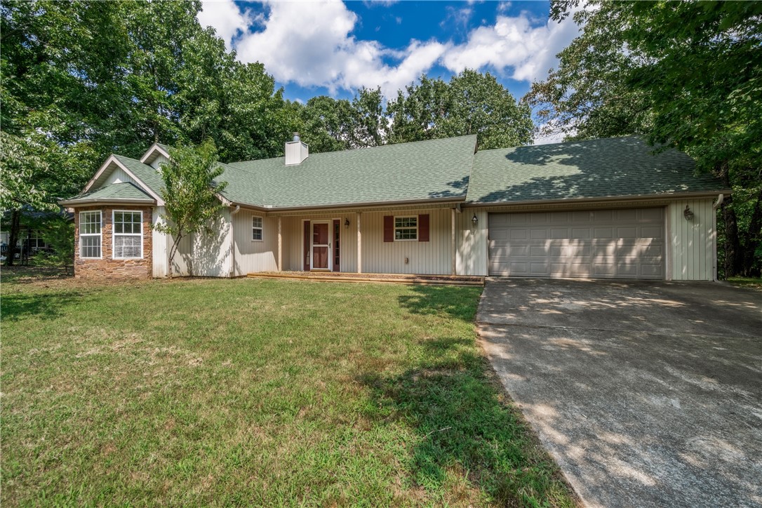 Peace, privacy, and wooded viewsāthis 1.52-acre Springdale retreat feels like a getaway but keeps you close to town. The sunroom steals the show, surrounded by glass and ready for all seasons.
Inside, fresh paint, new carpet (2025), and a 2022 roof mean the big stuff is done. The vaulted living room flows into a spacious kitchen with plenty of storage, prep space, and a breakfast bar. The primary suite offers double walk-in closets, a whirlpool tub, and direct access to that sunroom. Bonus perks include a workshop-ready garage and a backup generatorābecause comfort shouldnāt come with compromises.