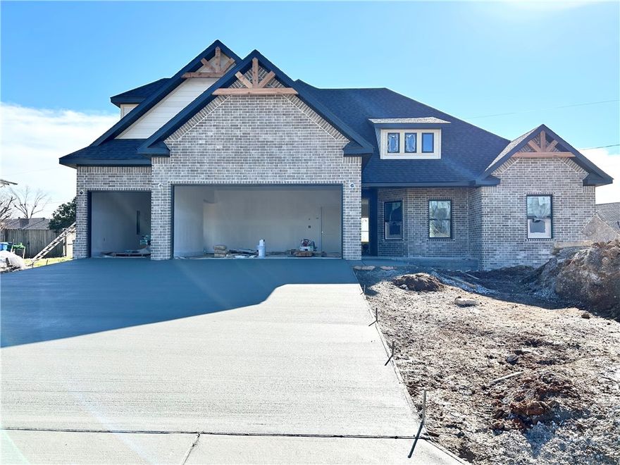 Check out this stunning new construction home with a 3-car garage on a .44 acre lot! Desirable location with easy access to I-49, Pinnacle Promenade, and downtown Rogers! Split floor plan. The primary suite boasts a large walk-in tile shower and a luxurious soaking tub for relaxation. The kitchen features floor-to-ceiling custom cabinets and a gas cooktop, complemented by elegant 3 cm quartz countertops. Custom finishes throughout. As an added bonus, receive $3,500 towards buyer's closing costs when working with the builder’s preferred local lender! Schedule your showing today!