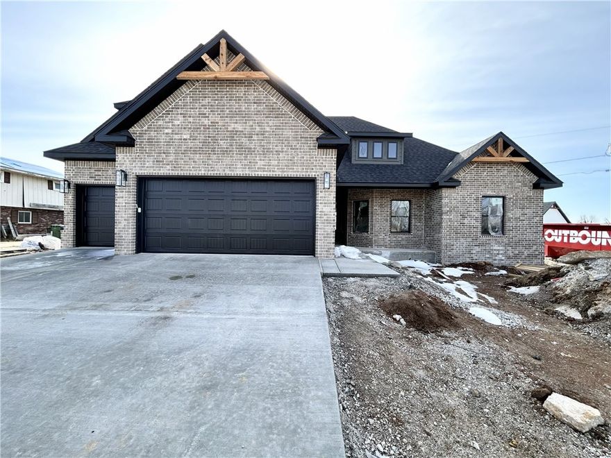 Check out this stunning new construction home with a 3-car garage on a .44 acre lot! Desirable location with easy access to I-49, Pinnacle Promenade, and downtown Rogers! Split floor plan. 4 bedrooms + bonus room! The primary suite boasts a large walk-in tile shower and a luxurious soaking tub for relaxation. The kitchen features floor-to-ceiling custom cabinets and a gas cooktop, complemented by elegant 3 cm quartz countertops. Custom finishes throughout. As an added bonus, receive $3,500 towards buyer's closing costs when working with the builder’s preferred local lender! Schedule your showing today!