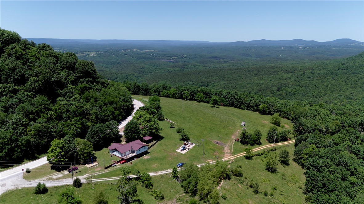 Mountaintop Living! Beautiful Views, Recreation, & Farmhouse Charm!
Perched high in the Ozarks near Mt Judea, this 14.2± acre mountaintop homestead offers lush hillside pasture with stunning eastern and northern views overlooking Gene Rush WMA. Step out the kitchen door and catch the sunrise over the valley. Bordering WMA land, itās perfect for hunting, hiking, and exploring right out your back door. The 1,700± sq ft home features 3 beds, 1 full bath, and 2 half bathsāeach large bedroom has its own half bath. The open-concept layout flows into a step-down kitchen with recent updates and a cozy farmhouse feel. Paved road frontage, a shop for storage or workspace, and a concrete pad ready for future use add value. Gently rolling pasture makes it great for a hobby farm or a smaller grazing operation. Just a short drive to the Buffalo River at Carver or Hasty and close to Hwy 7 and the Arkansas Grand Canyonāthis one checks all the boxes for rural living and outdoor adventure!