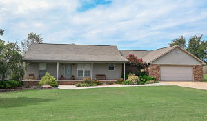 Immaculate and Manicured, Literally the perfect home! 1730 square feet and situated on almost 1 acre in Pottsville with a shop and storage! You should see this backyard and the beautiful layers of decking overlooking the private yard. This home is complete with 3 bedrooms and 2 bath and an entertaining friendly open floor plan and an oversized living room. Simply immaculate and move in ready. The master suite features a quiet nook for an office or overflow from closet. Plenty of extra workspace in the oversized garage. Located in Pottsville school district!