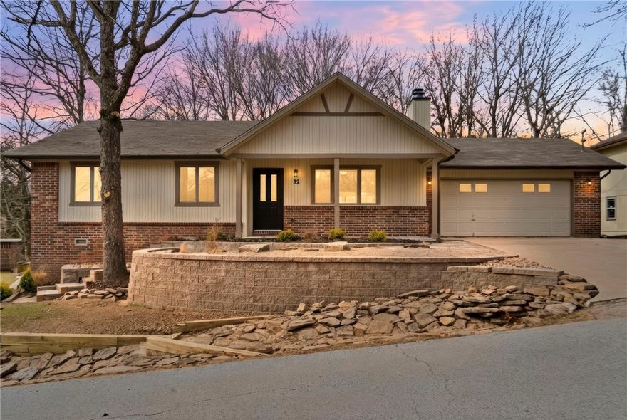 If you are looking for a beautiful and affordable home just moments from Lake Avalon, you've found it!  Don't miss this welcoming home in a perfect location, curb appeal and function radiating from the moment you pull up. You'll love the high ceilings and open living area, the functional layout and all the modern updates!  Picture yourself enjoying your afternoons in the sunroom overlooking your peaceful, fenced yard, or just take a look at the stylish finishes of your new kitchen and bathrooms.  Everything here has been redone with great care, from flooring, paint (inside and out) landscaping, light fixtures and so much more!  Nothing left but to move right in and enjoy living in this friendly neighborhood just up the street from the community beach area and close to bike paths and all the beauty Bella Vista has to offer.  Don't forget to check out the unfinished workshop space under the home, perfect for storage or a project space!