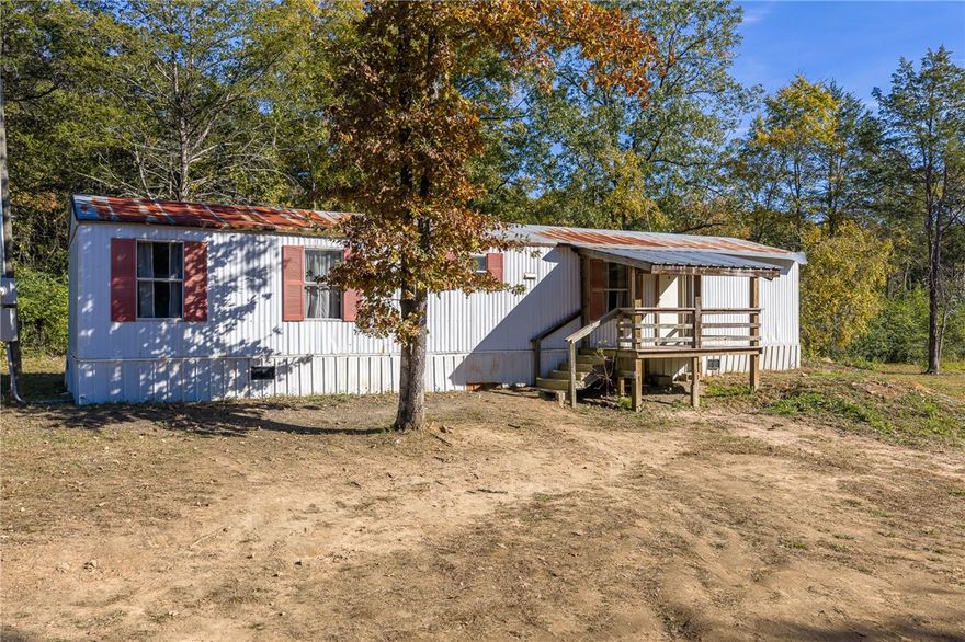 If you’re looking for a peaceful rural setting with a little extra space, this one might be for you! This remodeled older mobile home sits on approximately 2 acres and features 2 bedrooms and 2 baths. The home has been updated with new flooring throughout and features an eat-in kitchen with a double oven and refrigerator. All appliances—including the washer and dryer—will convey with the home. It’s total electric and equipped with energy-efficient mini-split heat and air unit. Enjoy quiet mornings or relaxing evenings on the nice covered front porch. Great opportunity for an investment property or a cozy place to call home! Home will not go FHA, RD or VA Loans.