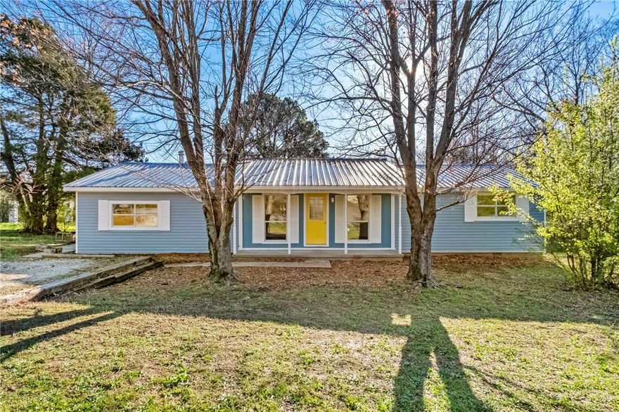 Location, location, location!  This charming 3-bedroom ranch-style home situated on a spacious half acre lot in a quiet, established neighborhood of East Fayetteville. This home offers approximately 1,440 sq ft of living space, featuring fresh paint, new carpet, and newer flooring throughout. The home includes a versatile living area and separate den with a wood-burning stove and a separate entrance that could easily serve as an office or flex space. Enjoy the outdoors from the covered deck overlooking the large yard with mature trees. Conveniently located near parks, trails, schools, shopping, and just minutes from popular areas like Gulley Park. Great opportunity for first-time buyers or investors looking for a centrally located property with plenty of potential