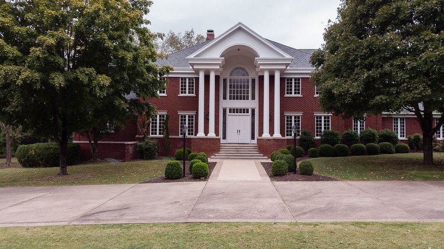 UNBELIEVABLE gated 7.79 acre estate property in East Fayetteville! Located in the center of town across from the entrance to Savanna Estates. Custom built 8,883 sq. ft. home with 3 levels plus walk-out basement. Large windows create bright and airy spaces. Quality built home with stunning marble and granite finishes, hardwood floors and ornate moldings, elegant Master Suite with 2 full baths, 3 additional full and 2 half baths, bonus room, 2 family rooms, office, game room, 4 staircases and 2 patios. Professional landscaping on beautiful flat acreage with mature trees. Great property for family living and entertainment. Never for sale before! Don't miss this once in a lifetime opportunity to own this park like estate property!