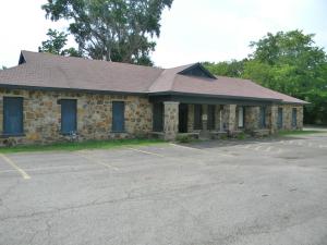 Lots of options with this 3,400 square foot commercial building plus 30x60 metal building. Good parking with approximately 40 spaces available. (Property can also be purchase WITHOUT the metal building on north side of property for $175,000. See MLS 20-1233. Property will need to be divided if buildings are sold separately.