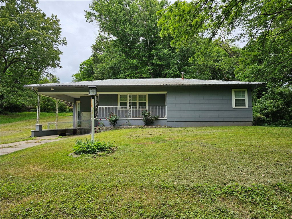 Welcome home! Step into this charming and updated two-bedroom, one-bath home, offering spacious rooms and a fenced-in backyard perfect for relaxation or entertaining. Located on a quiet dead-end street, you'll enjoy both privacy and convenience with easy access to highway 62. Plus, the unfinished basement provides a blank canvas to customize and make it your own.