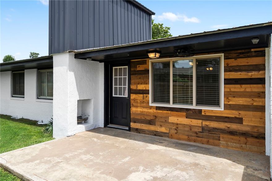 Nestled in the heart of Rogers, this retro ranch home offers timeless character with fresh exterior updates including a new metal roof in 2024. Situated directly on the Razorback Greenway and just minutes from vibrant downtown Rogers, this property is perfect for those who crave both serenity and city life. Inside, you’ll find 3 bedrooms, 2 full baths, 1,731 square feet, and original wood floors that bring warmth and character.  The layout is clean and open, with oversized windows, and just the right amount of vintage flair. While no longer operational, the fireplace awaits a modern update that suits your own personal style. Step outside and feel the space: generous 0.4 acre lot, fresh exterior paint, and an oversized carport.  Whether you're biking the Greenway or enjoying nearby shops and  restaurants, this location is truly hard to beat! Schedule your private tour today! Updated electrical, panel, new luxury vinyl in dining room and kitchen, recessed lighting in kitchen.