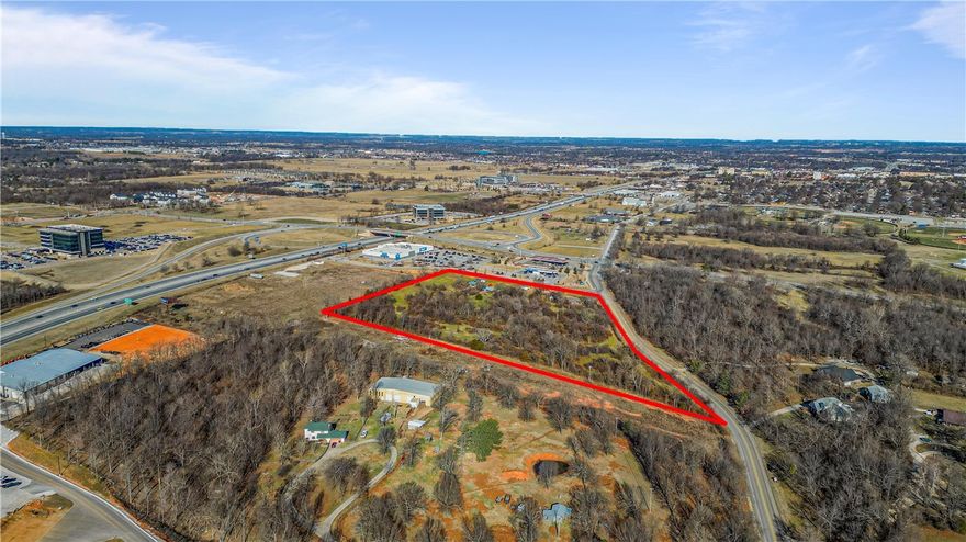 Amazing commercial land available for prime development opportunity.  This 10.55 acres would be suitable for Commercial or multi family development. 

Conveniently located next to Walmart Neighborhood Market and Casey’s General Store with close proximity to Arkansas Children's Hospital, Arkansas Natural's Baseball, Sam's Club and several restaurants.  Directly in between Fayetteville and Rogers, you’re right in the middle of the sought after NWA community 

Buyer will have access to the gravity sewer line to be installed along the western border. Buyer to confirm all items during due diligence period
Also listed as land MLS# 1286685