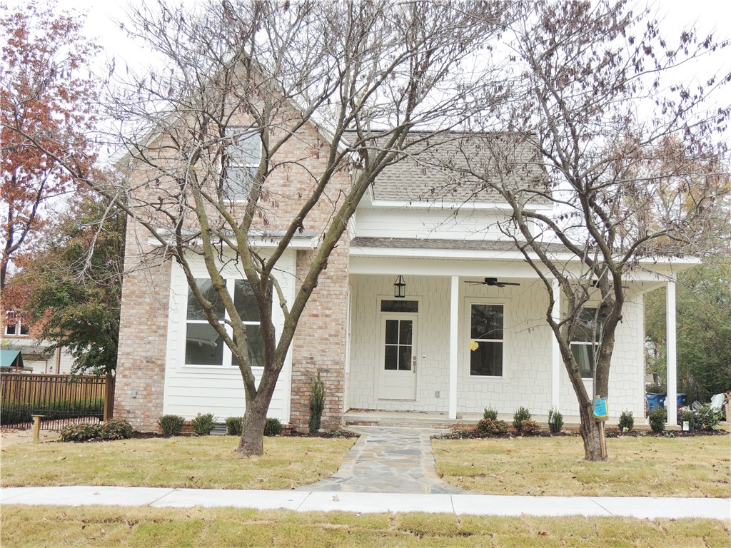 Beautiful brand new Downtown Bentonville home for lease! Just a short walk to the square. This home features 4BDRMs and 2.5BTHS. Bedroom on main level can also be an office. Bonus room/ 2nd living area upstairs with 2 bedrooms and full bath. Open floor plan with kitchen island and new Kitchen Aid appliances. This home has a carport with storage and the driveway is shared with neighbor in the back of the house.
