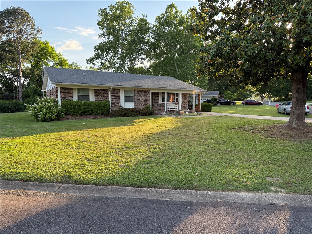 One Owner Home on a double lot. This 3 bedroom, 2 bath, 1,632 sq. ft open floor plan home is located on two (2) lots, lots 4 & 5 Razorback Addn. In addition the property has an approximate 240 sq. ft of attached and enclosed storage w/ full lanudry room, a 10' x 22' sun room, a detached 10' x 12' storage room, and an attached 8' x 8' storage room.
Beatutiful double lot, fully landscaped flower beds and mature trees.
