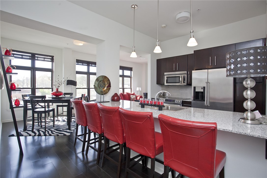Live in the heart of Fayetteville in this premier condo and be close to all the shopping, dining, bars, campus, gym, and trail system. Enjoy your panoramic views from the 5th floor. Watch the sun rise over Old Main, or sit outside on your private balcony facing Dickson St to people watch. Living room has an abundance of natural light beaming in. Master bedroom has ensuite bathroom and large walk in closet with amazing views. Metro styled plan.