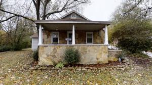 2 Bedroom, 1 1/2 Bath home on level corner lot with 2 car detached garage with 1/2 bath partially finished.