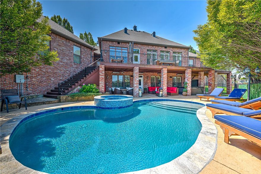 Imagine spending your summers by the sparkling gunite pool and relaxing spa or lounging on your spacious deck with views of the golf course and lake. You're greeted by a grand foyer leading into a bright and welcoming open-concept living area. The chef's kitchen features JennAir appliances, double ovens, and a gas cooktop.  Nearby, the cozy living room offers custom built-ins, a remote-control TV mount and a dining space that's just right for gathering around the table. The primary suite on the main floor feels like your own private getaway with a fireplace, and access to the private deck. The large walk-in closet is designed w/ built-in dressers and even a laundry chute. Hop into the elevator to the lower level, where the fun continues. Here you'll discover a huge laundry room, game room with a bar, a media room and an exercise room. Guests will appreciate the en-suite bedroom and two additional bedrooms sharing another full bath. Also, a golf cart garage for easy course access. Golf membership transferrable.