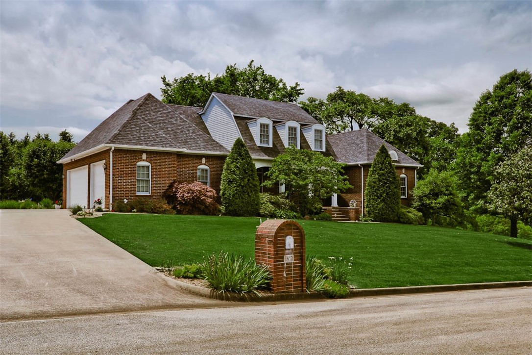 Custom Built Executive Home! This beautiful home features 4 bedrooms, 3 1/2 bath, hardwood floors, granite & marble countertops, new jetted tub in Master bath, walk-in-closets, formal dining with a walk-thru butler pantry to kitchen with floor to ceiling cabinets and an island, a lovely great room with cathedral octagon ceiling & wood burning fireplace, den/office/family room. Mature trees shade the deck for entertaining, partial basement for storage or workshop area, End of the street privacy. A beautiful place to call home.