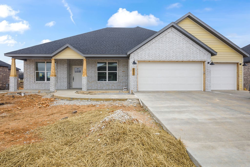 Welcome to Spring Creek Farms, located in the heart of Northwest Arkansas (Cave Springs/Elm Springs). There is something for everyone! A pool, playground & walking trails will be coming in phase 3. Shaw Elementary is just steps away. Enjoy pickleball, tennis, walking trails & more at nearby Shaw Park. Hurry to pick your favorite floor plan, lot & finishes. This neighborhood has spacious lots with many backing up to green space. Call for more details and options available. The Carlo Plan is a one-level, 4-bed, 2.5-bath layout designed with modern living in mind. Features include: 3 car garage, open floor plan, vaulted ceiling with beams, built-ins flanking a gas log fireplace, mud bench, soft close custom cabinets to the ceiling, gas range with fully vented hood, built-in microwave and a pantry with a barn door in the kitchen. The primary suite features a large walk-in shower for the ultimate spa-like experience. A large back covered patio is complete with internet and gas hookups, ready to entertain.