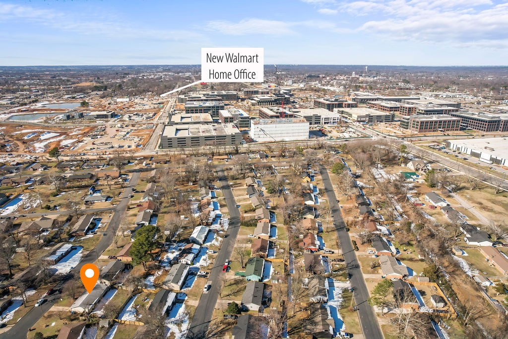 Investors and contractors seeking a prime location near the new Global Walmart campus will find this property an exceptional opportunity. Situated on an arterial road and within walking distance of the 10th Street entrance to the Fortune 1 company's headquarters, this formal rental boasts a coveted address. While the value lies primarily in the land, the property offers significant potential for development, including building on the existing footprint to maximize its strategic position.