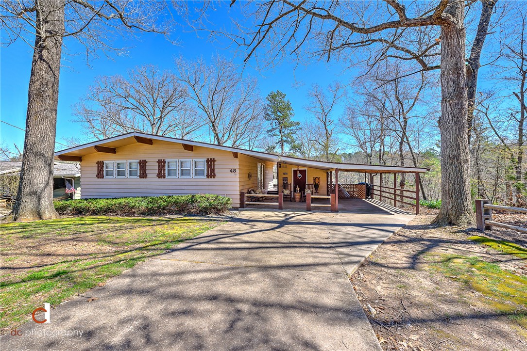 BIKE IN BIKE OUT! Minutes from I-49, 10 minutes from downtown Bentonville, this home is a dream. You will be surprised at how open and airy this home is. Nestled among the trees with the new mountain bike trail directly down the hill, the ease of enjoying the outdoors is unmatched. Sugar creek fishing just a walking distance away off the mountain biking trail. Enjoy the tree top evenings in the screened in back porch. Along with heated and cooled work area in basement. Also, home owners installed ultraviolet air purifier system in 2018.