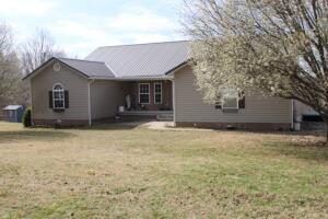 Spacious, Comfy & Only $53,27 Avg Electric Bill - Solar Panel system included!! Enjoy 4 acres, Terrific Views, & over 3,100 sq ft living area plus lots of storage, 2 attached garages, detached shop with part converted to music studio, 10 x 56 covered deck Plus 35 solar panels less than 2 yrs old nearly wiping out the electric bill - info in Documents tab. Split bedroom plan, 3 beds-3 bath, living room, sunroom, attractive kitchen with granite counter tops, all appliances, breakfast & dining areas. Fantastic basement with family room, gas fireplace, kitchenette/ wet bar, 3rd bedroom and bath. Some unfinished area for storage plus basement garage or work area. Outside there's a pad ready for above ground pool, a 26 x 28 shop/studio plus 12 x 28 carport or entertaining area. Call Today!!