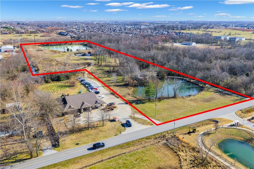 Prime 11+ acre development opportunity in Bentonville's growth corridor, minutes from city center and Walmart Home Office. This exceptional property offers incredible potential for subdivision or commercial development with multiple parcels and valuable Greenhouse Road frontage. The land features cleared and wooded areas, two scenic ponds, and abundant wildlife - perfect for a distinctive residential community or mixed-use project. Located in one of America's fastest-growing markets near shopping, schools, and Northwest Arkansas's booming business district while maintaining a peaceful setting. With over 11 acres and additional parcels providing flexibility, developers will appreciate the rare combination of size, location, and accessibility. The proximity to major employers and amenities, coupled with Bentonville's explosive growth, makes this a standout investment opportunity. Don't miss this chance to capitalize on Northwest Arkansas's continued expansion.