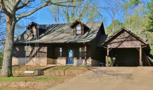 Cedar doll house with two full baths and a walk-in closet to die for! Stainless steel appliances,laminate flooring,spacious storage carport and new roof and skylights as well as brand new tile and fresh stain and paint in 2016! Great location in north Dardanelle with a beautiful lot and fire pit in backyard...It's a must see!