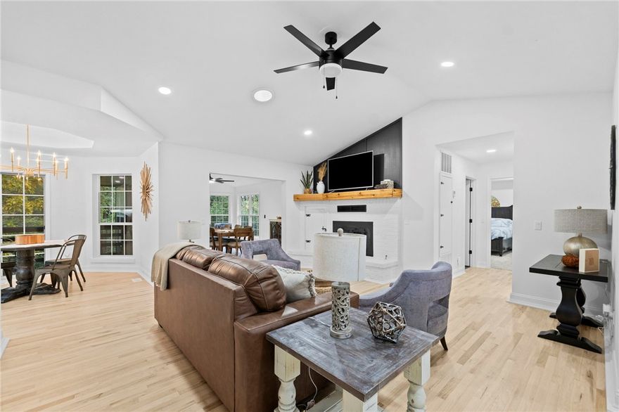 ***Sellers now offering a $5,000 buyer incentive!!! Welcome to 5 Dunvegan Ln in Bella Vista—an absolutely gorgeous, fully remodeled home that’s move-in ready. Freshly painted inside & out, the home features cedar accents on the front exterior for standout curb appeal. Inside, you’ll find quartz countertops, brand-new custom kitchen cabinetry, hardwood floors, LVP flooring, & tile flooring in the bathrooms. Light & open living areas create an inviting atmosphere, flowing into a sunroom that’s perfect for relaxing or entertaining. The upstairs living room features a cozy wood-burning fireplace, while the basement offers a bonus living space complete with a new wet bar & electric fireplace. Enjoy multiple outdoor living options—ideal for morning coffee or evening gatherings. With three bedrooms, three bathrooms, thoughtful upgrades throughout, & a location less than 10 minutes from the new OZ Trails Bike Park, this home is priced to sell & ready for its next owner. All furniture is negotiable with an acceptable offer!