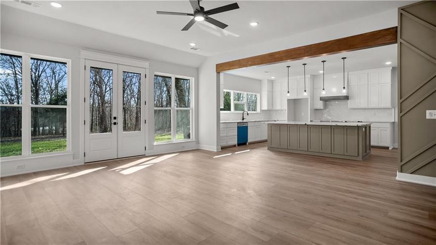 Enjoy Space, Privacy, and Nature Just 20 Minutes from Bentonville. Escape the city without sacrificing convenience. This stunning home offers the perfect blend of privacy and accessibility. Tucked on a wooded 1.36-acre lot, you'll enjoy the peace of nature, mature trees, and the space to truly spread out. Inside, the home features 4 spacious bedrooms and 3 full bathrooms, thoughtfully designed to maximize every square foot. The oversized garage gives you room for storage or a workshop, while the 10 ft ceilings in the living area and the expansive entryway with 8 ft double front doors create a grand, welcoming feel from the moment you walk in. Luxury vinyl plank flooring runs throughout the home, adding both durability and style. Step outside and relax on not one but two covered patios in the front and back, ideal for morning coffee or evening wind downs surrounded by nature.This property brings the best of both worlds. Peaceful living with modern luxury just minutes from town.