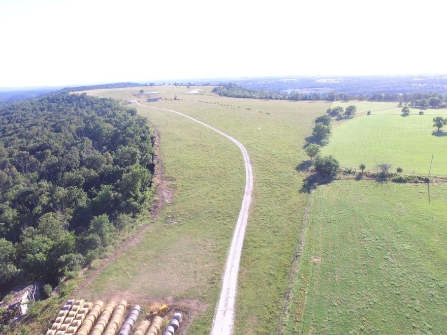 Turn this gorgeous 320-acre cattle farm into your very own private oasis! Own this mountaintop property & build your dream home with awesome views overlooking the valley. The rolling, well-fenced acreage is clean with approximately 40% pasture and 60% timber, plus 3 ponds. Has a couple of improvements. There is plenty of water available. Small metal shed & well house are on property. Extremely great hunting! Dwelling of no value. Just imagine... Come home from an exhausting day in the crowded city & just relax with no one around!! Peaceful! Quiet! Secluded!