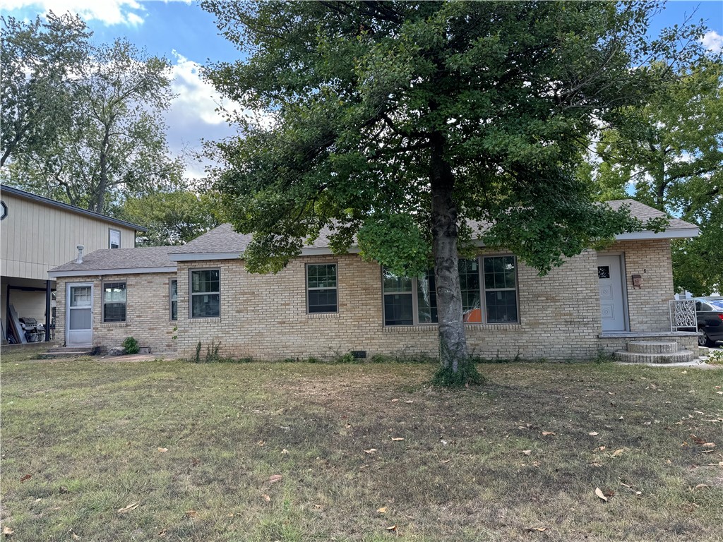 GREAT potential for commercial business on busy main road - Mount Olive St - thru the heart of Siloam Springs! Located across from the Siloam Food Court and commercial shopping center, this property sits on a large .33 acre +/- lot! Also features a large detached building that is great for storage or additional work space/office space. Home still needs some renovations but has recently had new double pane vinyl windows installed, new interior paint, and new carpet. There are 4 total doors to the outside so could easily be separate access for rental spaces .. Located within walking distance to schools, downtown Siloam Springs, parks, etc and LESS THAN A MILE TO HWY 412! THIS PROPERTY IS NOT CURRENTLY ZONED COMMERCIAL. Buyer needs to do Due Diligence for themselves with City of Siloam Springs.